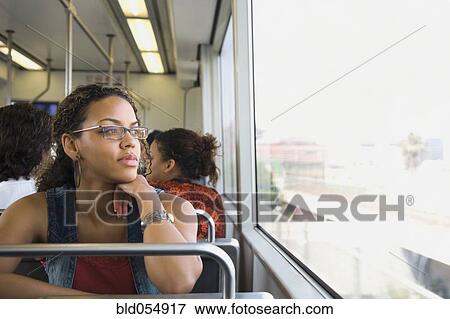 Stock Photo - African woman riding on train. Fotosearch
