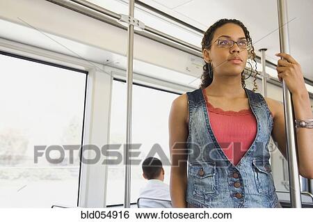 Stock Photograph - African woman riding on train. Fotosearch