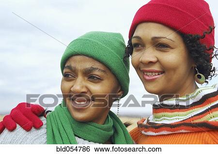 Stock Photograph - African women wearing winter hats and scarves. Fotosearch