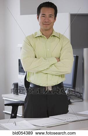 Asian businessman with arms crossed View Large Photo Image Stock Photo - Asian businessman with arms crossed. Fotosearch
