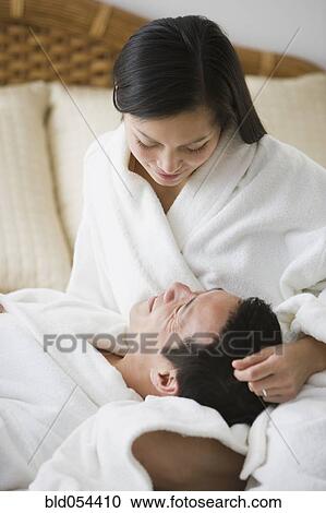 Asian couple smiling at each other View Large Photo Image Stock Image - Asian couple smiling at each other. Fotosearch
