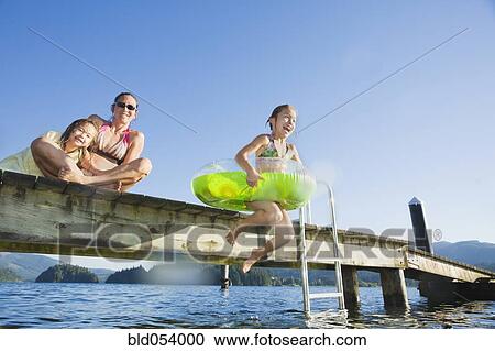 Asian girl jumping in lake Stock Image | bld054000 ...