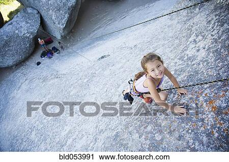 Asian girl rock climbing View Large Photo Image Stock Image - Asian girl rock climbing. Fotosearch