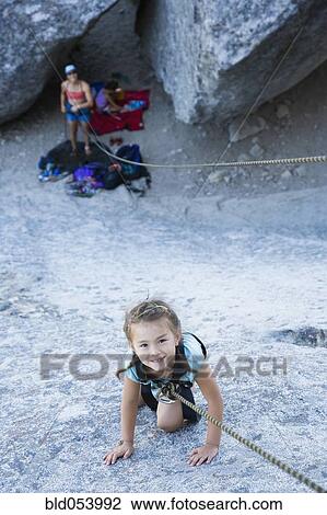 Asian girl rock climbing View Large Photo Image Stock Image - Asian girl rock climbing. Fotosearch