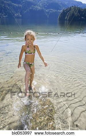 Asian girl splashing in lake View Large Photo Image Stock Photo - Asian girl splashing in lake. Fotosearch