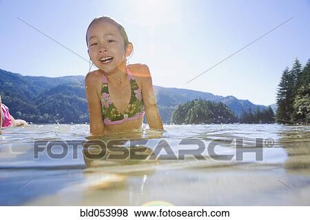 Asian girl standing in lake View Large Photo Image Stock Photo - Asian girl standing in lake. Fotosearch