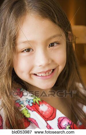 Stock Photo - Close up of Asian girl smiling. Fotosearch