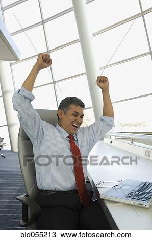 Hispanic businessman cheering View Large Photo Image Stock Image - Hispanic businessman cheering. Fotosearch