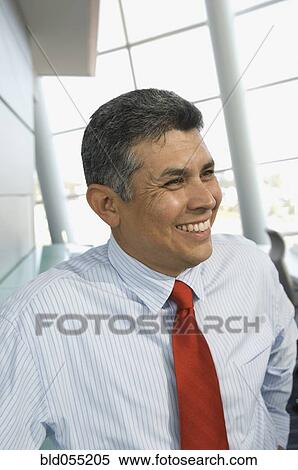 Hispanic businessman looking to side View Large Photo Image Stock Photography - Hispanic businessman looking to side. Fotosearch