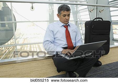 Hispanic businessman typing on laptop View Large Photo Image Stock Photography - Hispanic businessman typing on laptop. Fotosearch