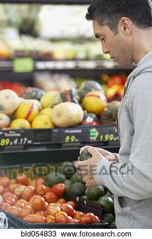 Hispanic man shopping for produce View Large Photo Image Stock Image - Hispanic man shopping for produce. Fotosearch