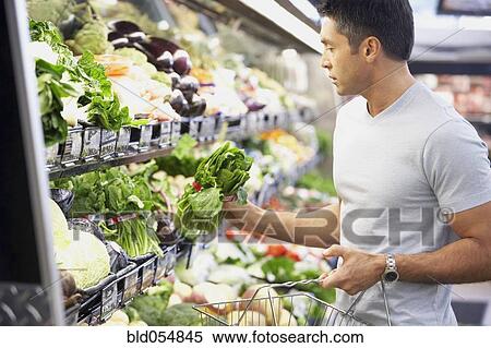 Hispanic man shopping for produce View Large Photo Image Stock Photography - Hispanic man shopping for produce. Fotosearch