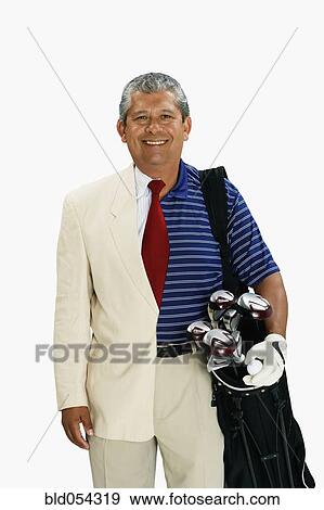 Stock Photo - Hispanic man wearing half business suit half golf outfit. Fotosearch