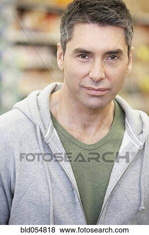 Stock Photo - Hispanic man wearing sweatshirt. Fotosearch