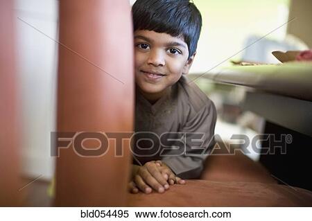 Indian boy laying on floor View Large Photo Image Stock Photography - Indian boy laying on floor. Fotosearch