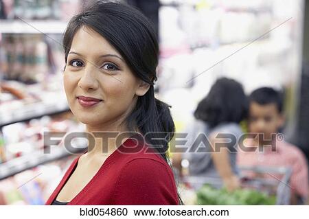 Indian mother in grocery store View Large Photo Image Stock Image - Indian mother in grocery store. Fotosearch