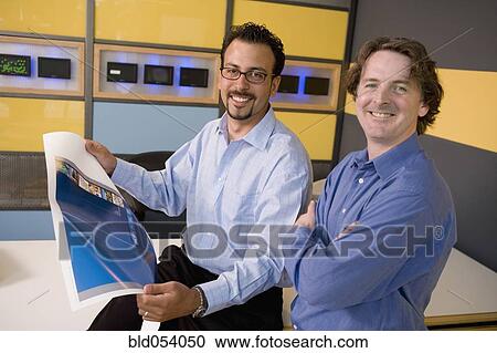 Multi-ethnic male graphic designers in office View Large Photo Image Stock Image - Multi-ethnic male graphic designers in office. Fotosearch