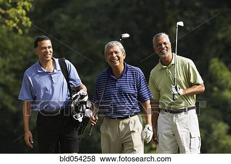 Multi-ethnic men playing golf View Large Photo Image Stock Photo - Multi-ethnic men playing golf. Fotosearch