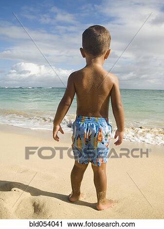 Pacific Islander boy looking at ocean View Large Photo Image Stock Image - Pacific Islander boy looking at ocean. Fotosearch