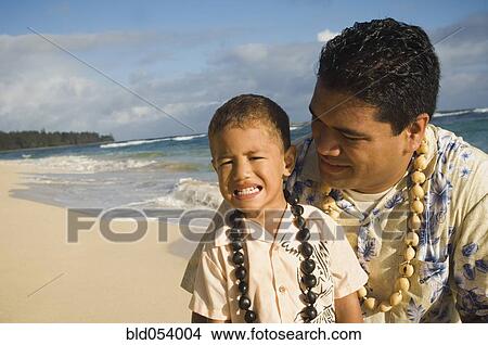 Pacific Islander father and son at beach View Large Photo Image Picture - Pacific Islander father and son at beach. Fotosearch