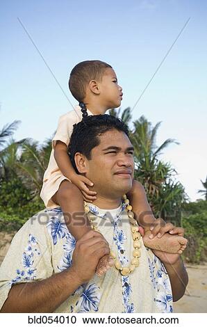 Pacific Islander father with son on shoulders at beach View Large Photo Image Stock Image - Pacific Islander father with son on shoulders at beach. Fotosearch