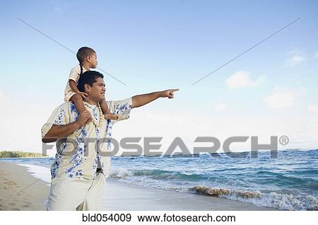 Pacific Islander father with son on shoulders at beach View Large Photo Image Stock Photo - Pacific Islander father with son on shoulders at beach. Fotosearch