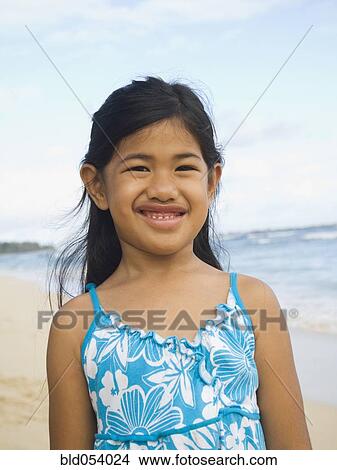 Picture - Pacific Islander girl at beach. Fotosearch