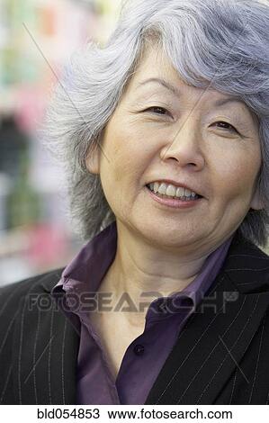 Stock Image - Portrait of senior Asian woman. Fotosearch