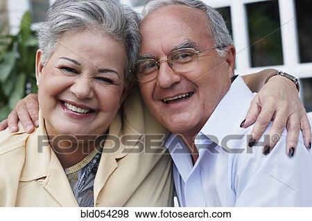 Senior Hispanic couple hugging View Large Photo Image Stock Photo - Senior Hispanic couple hugging. Fotosearch