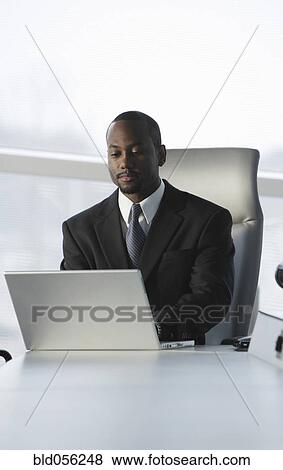African American businessman typing on laptop View Large Photo Image Stock Photo - African American businessman typing on laptop. Fotosearch