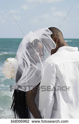 African bride and groom at beach View Large Photo Image Stock Image - African bride and groom at beach. Fotosearch