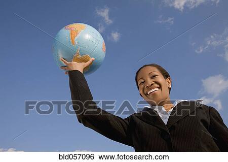 African businesswoman holding globe View Large Photo Image Stock Photograph - African businesswoman holding globe. Fotosearch