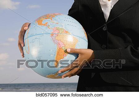 African businesswoman holding globe View Large Photo Image Stock Photography - African businesswoman holding globe. Fotosearch