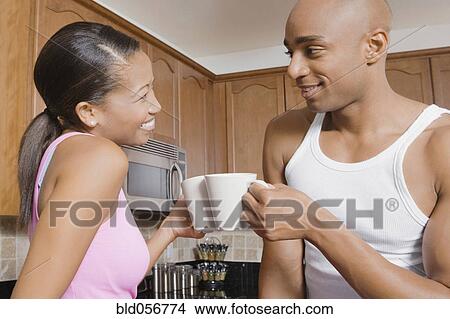 Picture - African couple drinking coffee. Fotosearch