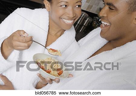 African couple eating breakfast View Large Photo Image Stock Photography - African couple eating breakfast. Fotosearch