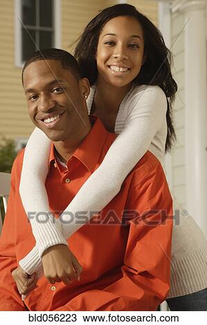 Stock Image - African couple hugging. Fotosearch