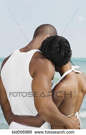 Stock Photo - African couple hugging. Fotosearch