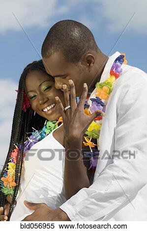 Stock Photography - African couple hugging. Fotosearch