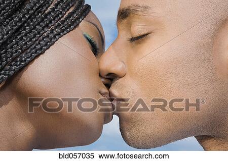 Stock Photography - African couple kissing. Fotosearch