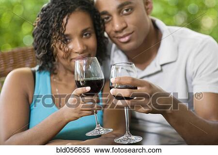 African couple toasting with wine View Large Photo Image Stock Photography - African couple toasting with wine. Fotosearch