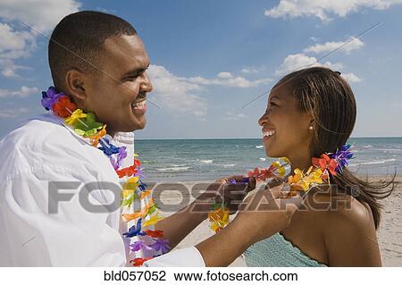 African couple wearing leis View Large Photo Image Stock Image - African couple wearing leis. Fotosearch