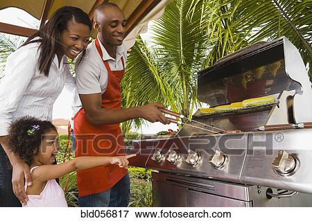 Stock Photo - African family barbecuing. Fotosearch
