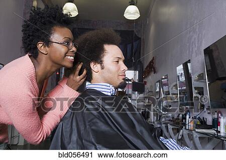 African hair stylist styling Mixed Race man’s hair View Large Photo Image Stock Image - African hair stylist styling Mixed Race man’s hair. Fotosearch