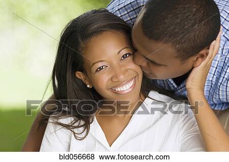 African man kissing wife’s cheek View Large Photo Image Stock Photo - African man kissing wife’s cheek. Fotosearch