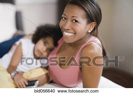 African mother hugging daughter View Large Photo Image Stock Image - African mother hugging daughter. Fotosearch