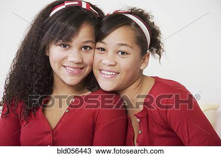 African twin sisters hugging View Large Photo Image Stock Image - African twin sisters hugging. Fotosearch