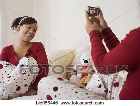 African twin sisters taking photograph View Large Photo Image Stock Photograph - African twin sisters taking photograph. Fotosearch