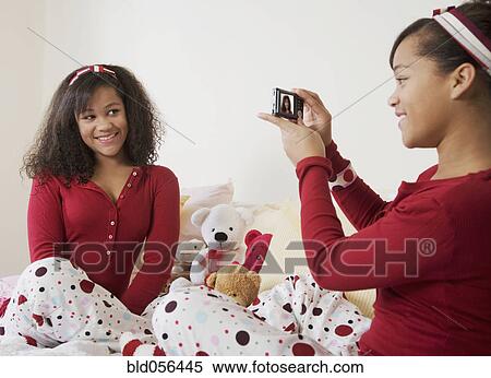 African twin sisters taking photograph View Large Photo Image Stock Photography - African twin sisters taking photograph. Fotosearch