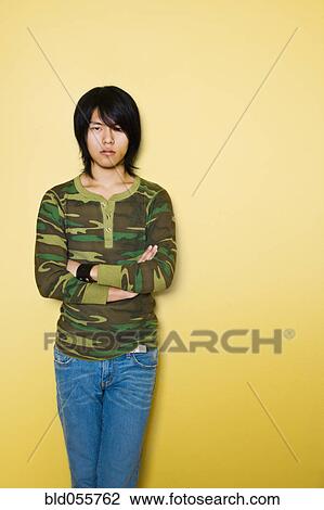 Asian man with arms crossed View Large Photo Image Stock Image - Asian man with arms crossed. Fotosearch