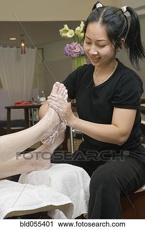 Asian spa technician giving massage View Large Photo Image Stock Image - Asian spa technician giving massage. Fotosearch